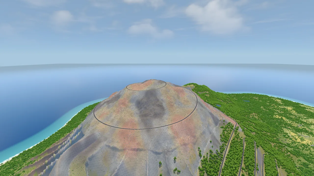 The bare cinder summit of the volcano from the air, the road spiralling round it and the coast far below.